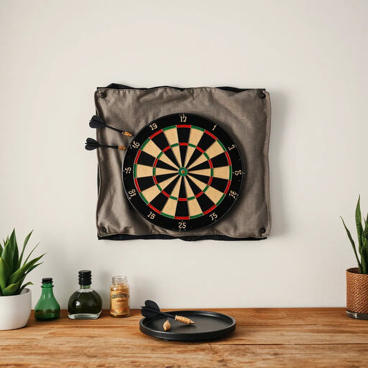 Mounted dartboard with a protective backboard behind it on a wall in a clean indoor setting